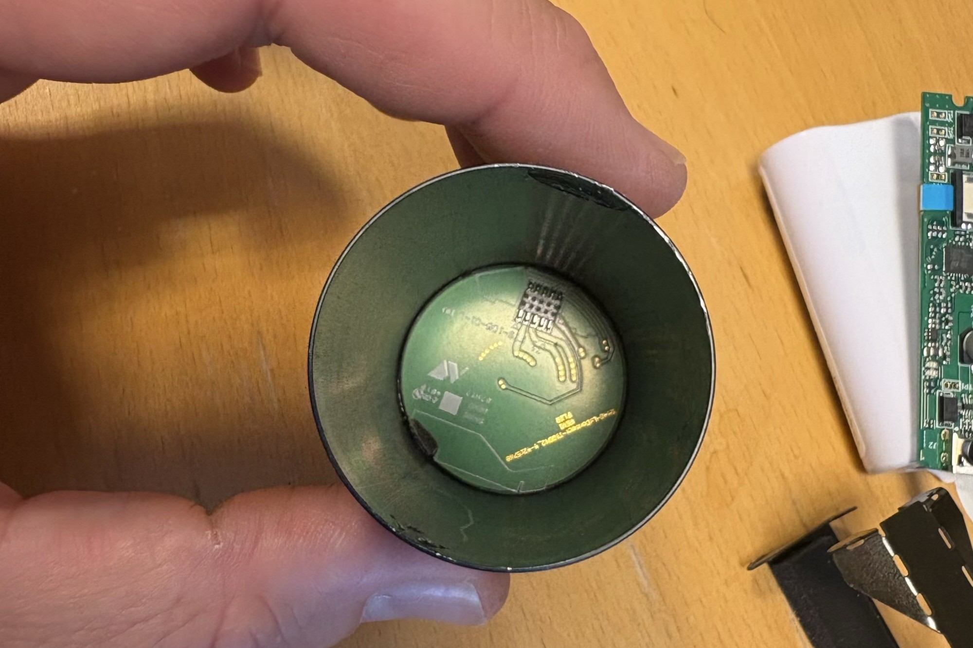 Circular connector housing removed to expose its internal PCB contacts